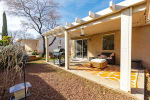 View of yard featuring a pergola and a patio