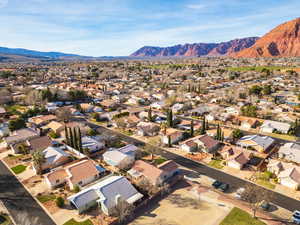 Aerial view of residential area featuring a mountainous background