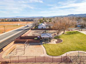 Aerial perspective of suburban area with a mountainous background