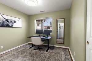Home office featuring baseboards