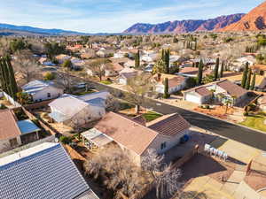 Aerial view of residential area featuring mountains