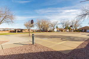 View of basketball court with a residential view