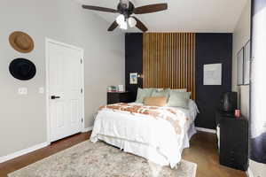 Bedroom with an accent wall and ceiling fan