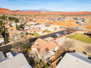 Aerial perspective of suburban area with a mountainous background