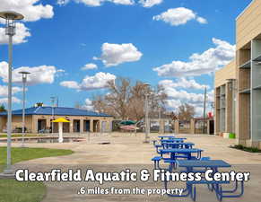 Clearfield aquatic center with an indoor pool, lazy river, hot tub and outdoor splash pad.