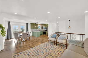 Living room featuring light wood-type flooring, recessed lighting