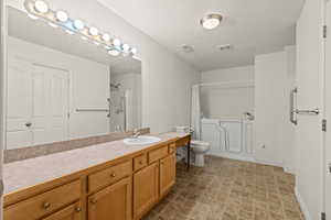 Primary bedroom with en-suite bathroom; shower and walk-in tub