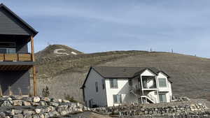 View of home's exterior featuring a balcony