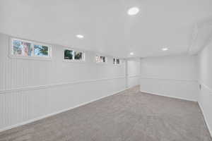 Below grade area featuring carpet, plenty of natural light, and recessed lighting