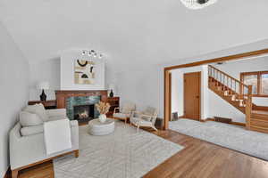 Living area with light wood finished floors and a fireplace