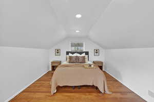 Bedroom featuring light wood-type flooring and recessed lighting