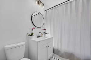 Full bath with vanity and toilet