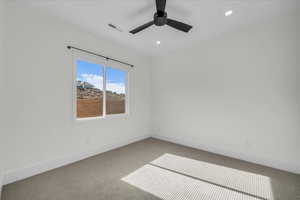 Empty room with light colored carpet, recessed lighting, and a ceiling fan