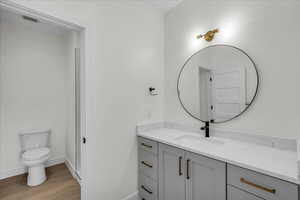 Bathroom featuring vanity and light wood-style flooring