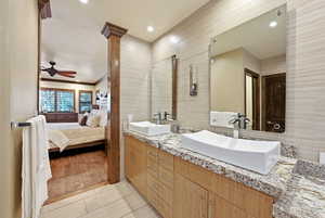 Full bathroom with connected bathroom, double vanity, a ceiling fan, and recessed lighting
