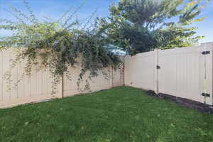 View of yard with a gate