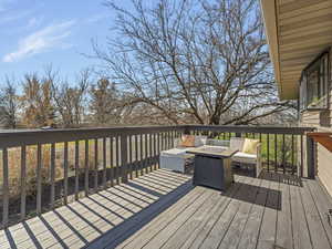 Wooden terrace with an outdoor fire pit