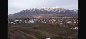 View of mountain background featuring nearby suburban area