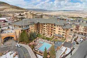 Aerial view of a mountain backdrop and a pool area