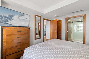 Bedroom with recessed lighting and a closet