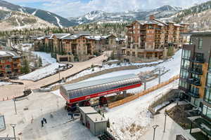 Snowy aerial view featuring a mountain view