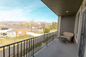 Balcony featuring a mountain view and a residential view