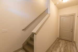 Stairway with wood finished floors