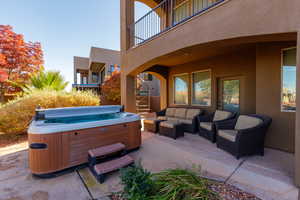 Patio / terrace featuring an outdoor lounge area, a patio area, and a hot tub