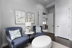 Sitting room with wood-type flooring