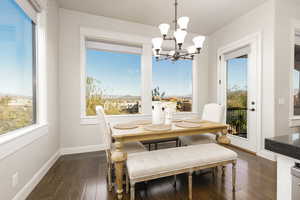 Dining room featuring wood-style floors and a chandelier