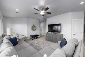 Living area featuring recessed lighting, a ceiling fan, and light carpet