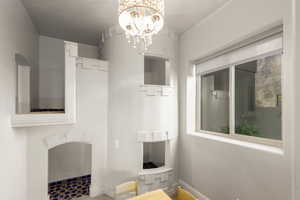 Kids playhouse complete with chandelier over table and chairs