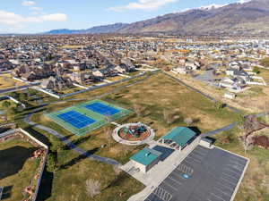 Aerial view of property's location featuring a mountainous background and nearby suburban area