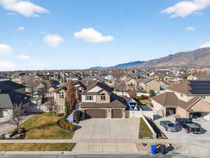 Aerial view of residential area with a mountainous background