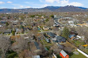 Aerial perspective of suburban area with a mountain backdrop