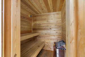 Relaxing sauna / steam room featuring wood walls and wood ceiling