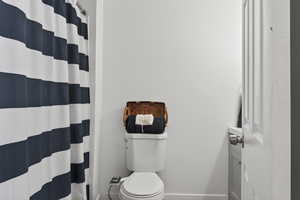 Full bath with a shower with curtain and vanity