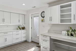 Basement Kitchen with open shelves, white cabinetry, and recessed lighting