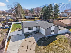 Aerial perspective of suburban area with a mountainous background