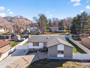 Aerial perspective of suburban area featuring a mountain backdrop
