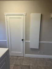Bathroom featuring vanity and washer / dryer