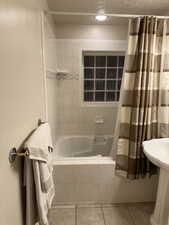 Full bathroom featuring tiled shower / bath
