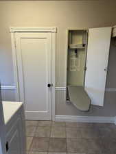 Bathroom featuring vanity and washer / clothes dryer