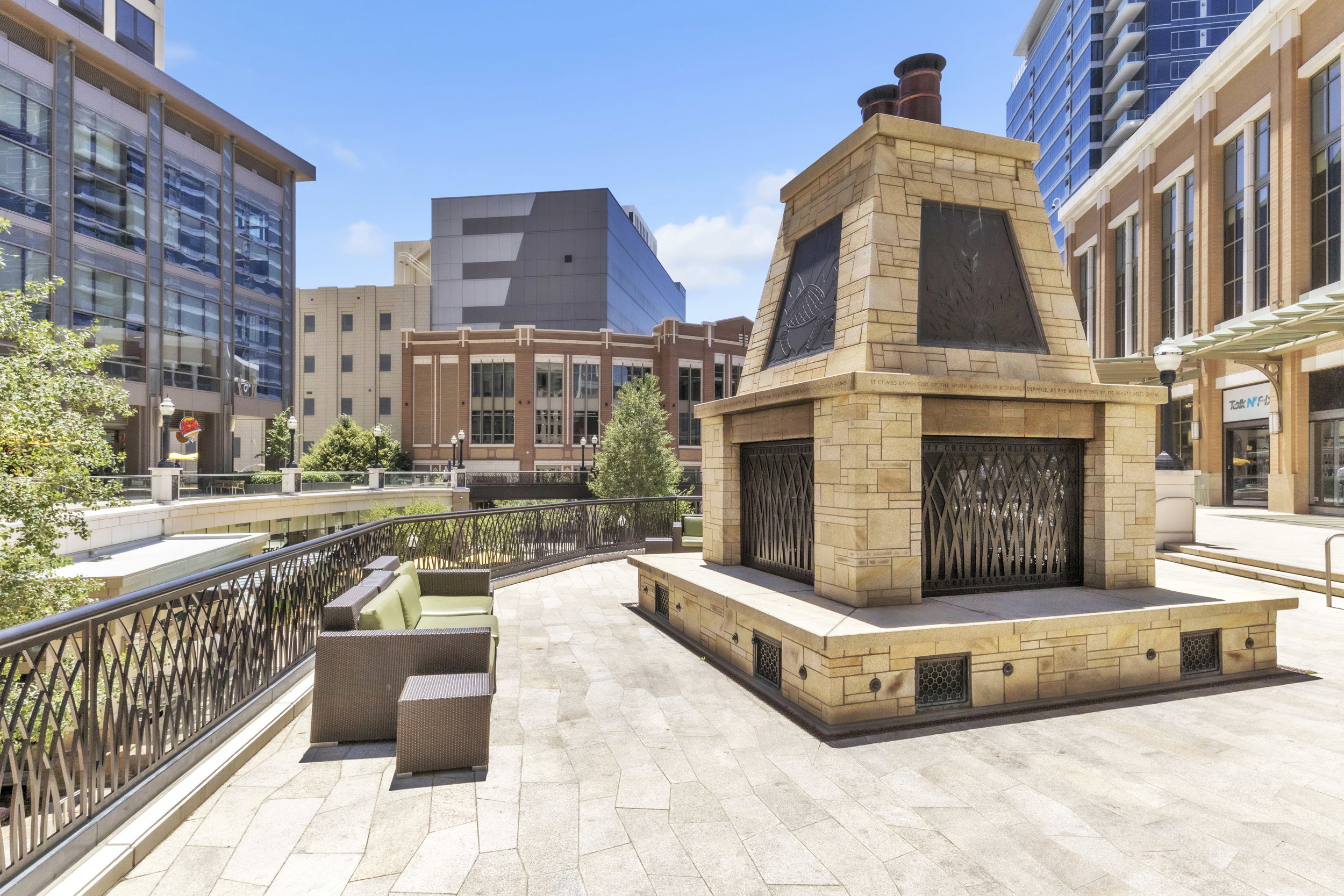 View of patio / terrace featuring an outdoor stone fireplace