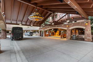 Entrance to property featuring stone siding