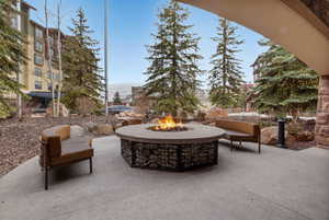 View of entrance patio with an outdoor fire pit