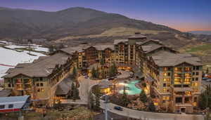 Drone / aerial view of mountains and a pool