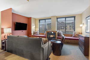 Living area featuring a glass covered fireplace
