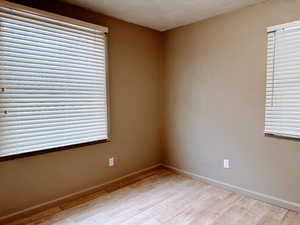 Spare room with wood tiled floors and a textured ceiling