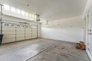 Garage featuring a garage door opener